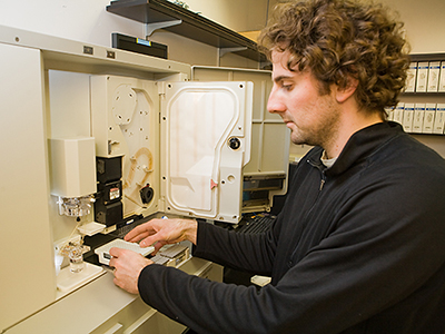 A graduate student conducts research in the CBFG.