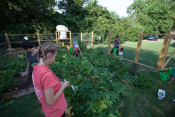 Female with students in garden