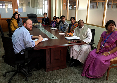 Dr. Vaishali Raval (far left) meets with US and Indian collaborators to study teen depression and anxiety in India.