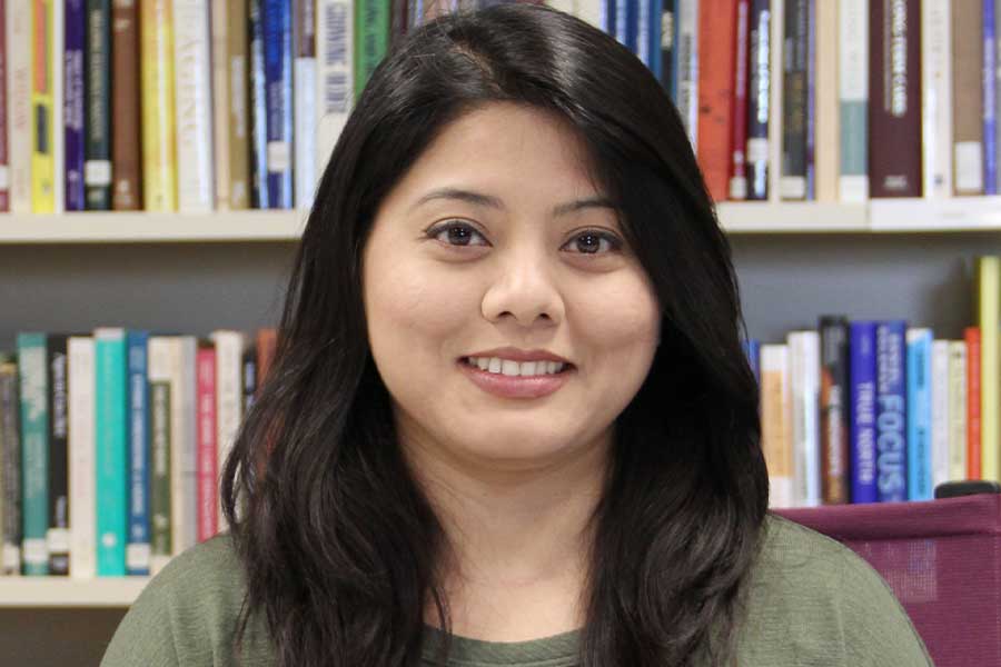 Professional headshot of Isha Karmacharya.