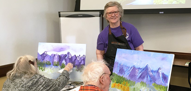 male volunteer presenting to retirees participating in a class