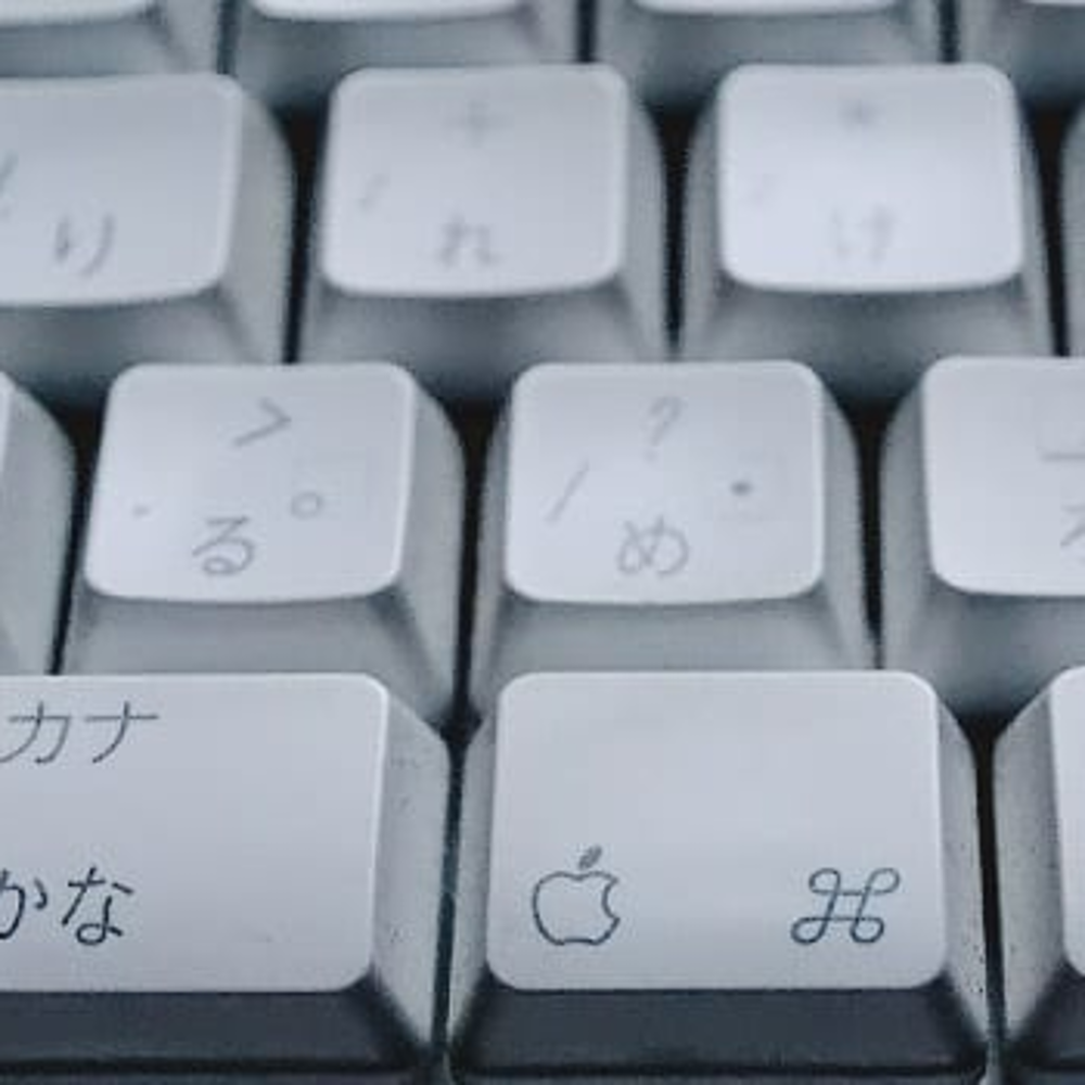 A decorative picture of a keyboard with Japanese characters on it.