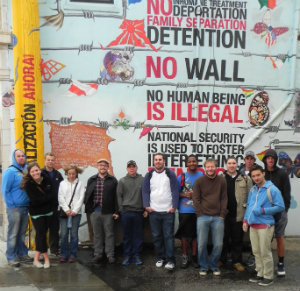 Students in front of Pilsen Mural for Immigration Reform