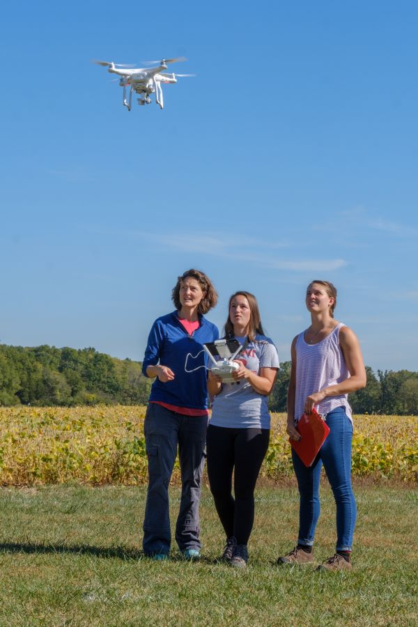 students flying a drone