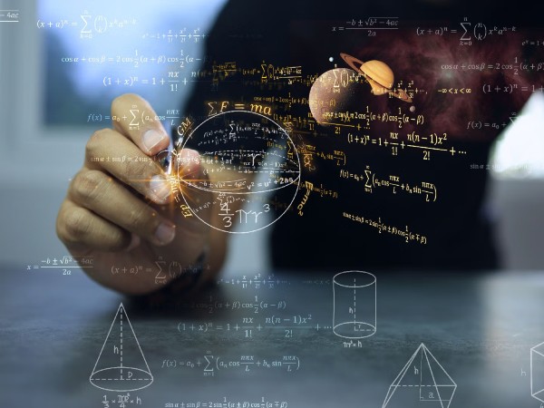 Person writing equations amid floating math, geometry, and planetary imagery.  