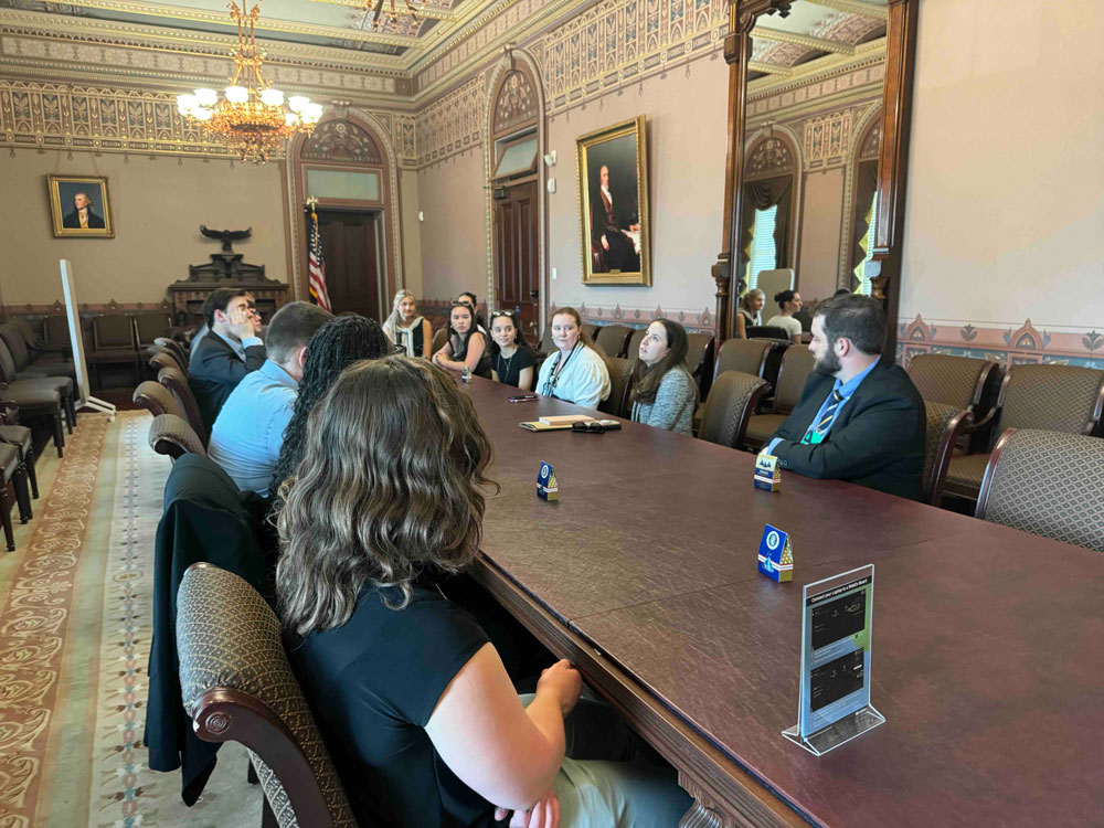 Students meeting with a law maker in DC.