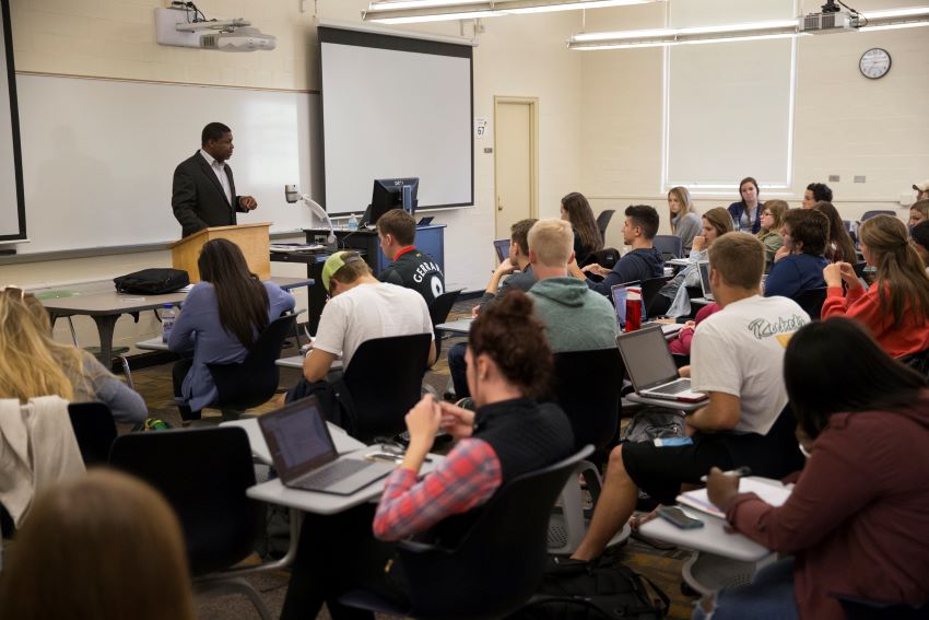 Professor leads students in a class lecture.