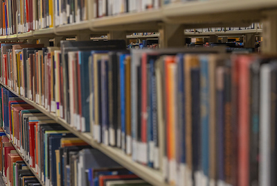 books on a book shelf in a library