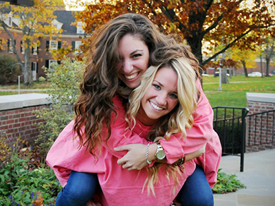 Alissa Pollack gets a piggyback ride from a friend
