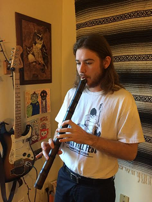 Rowland Taylor practices playing a shakuhachi.