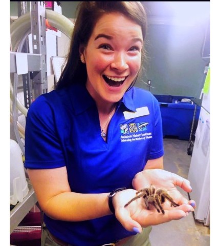 Shelley Shrader hold a spider