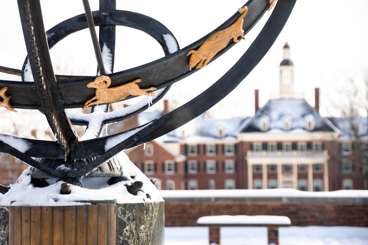 The sundial on Miami's campus covered in snow.