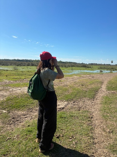 A student using binoculars