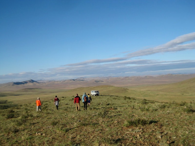 Students walking across the landscape of Mongolia