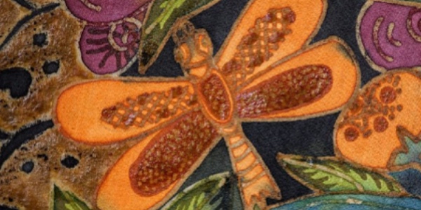 Orange dragonfly on cloth