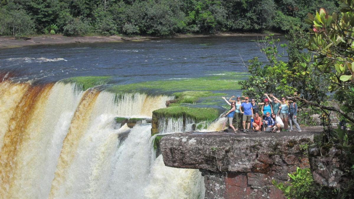 Earth Expeditions students in Guyana at Kaieteur Falls. Kaieteur is one of the highest, most spectacular, and most powerful waterfalls in the world. Its thunder can be heard long before visitors glimpse this magnificent cascade. Photo by Global Field Program graduate Scott Vincent '18 of Cincinnati, Ohio.