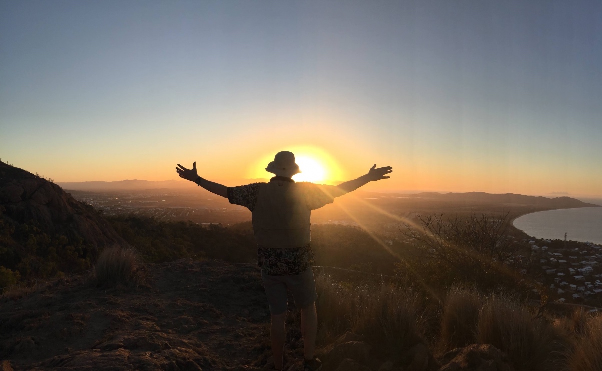 A person spreading their arms to the sky.