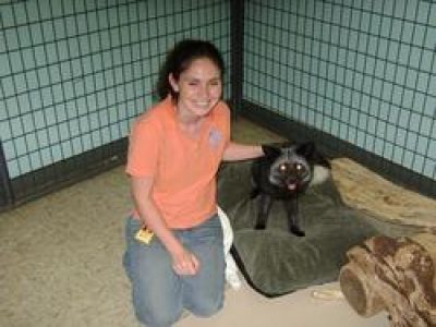 women petting animal