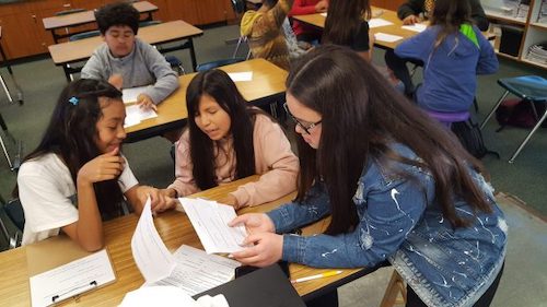 teacher helping student