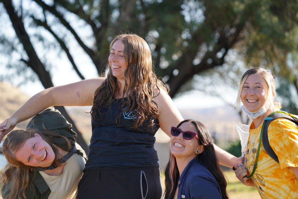 Miami University graduate student Sara Blanton (standing) of Fullerton, California, in Namibia with (from left) GFP graduate Emily Moore '22 of South Euclid, Ohio, and current students Ramona Wallace of San Diego, California; and Dania Grant of Poway, California, making big memories at the Cheetah Conservation Fund headquarters during last summer's Earth Expeditions course. Photo by GFP student Kate Salva of Grafton, Ohio.