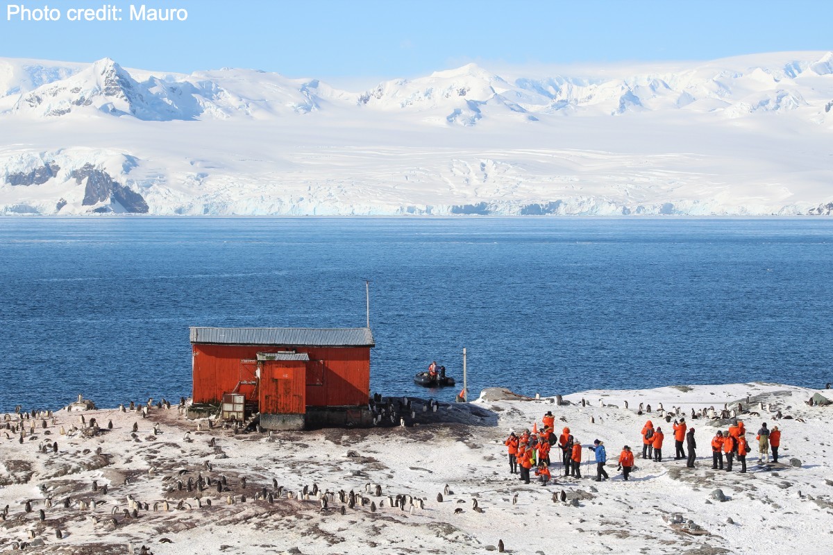Red Shack with people around it