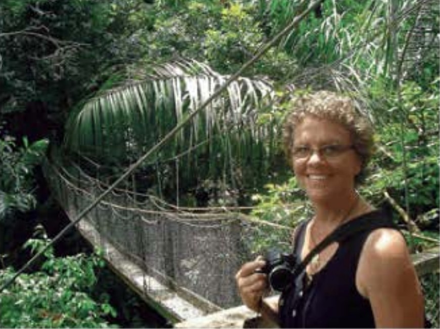 lady smiling in a rainforest 