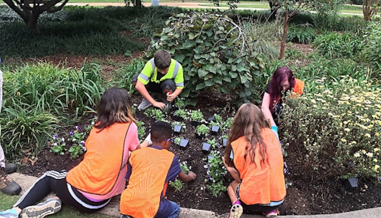 kids working in a garden 