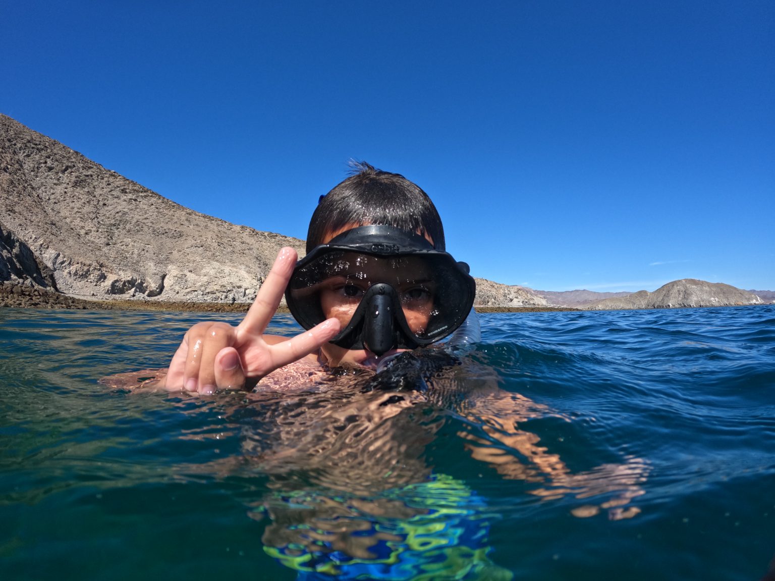 man swimming in the ocean