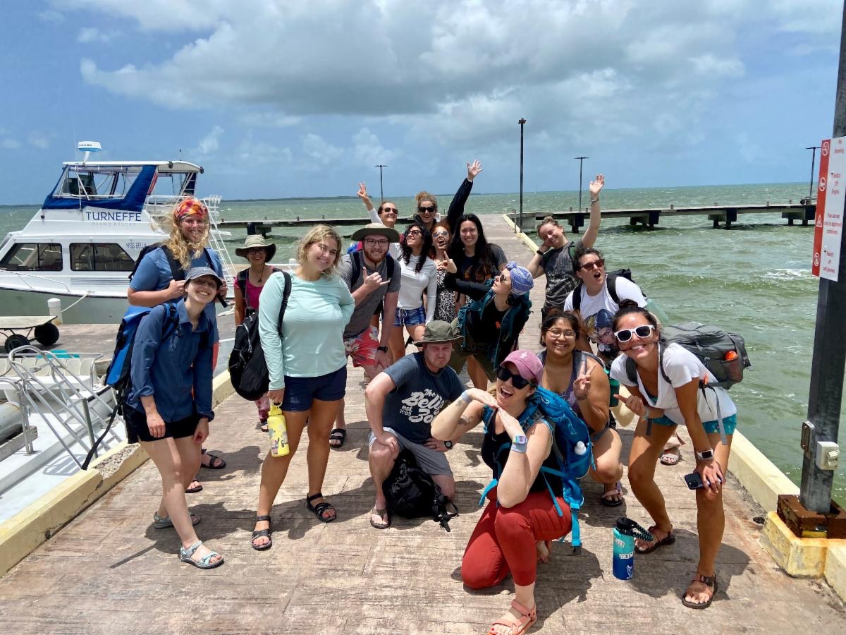 Students standing on a pier.
