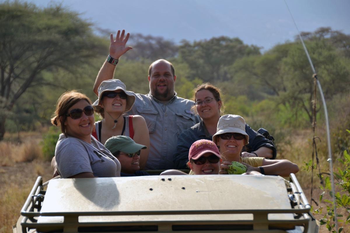 Students in the back of a jeep.