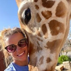 Emily Williams with a giraffe