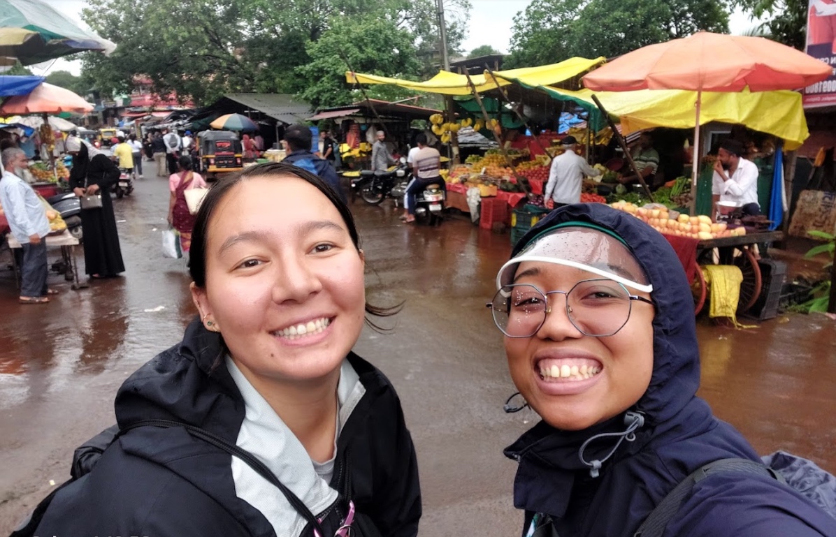 Two students smiling to camera.