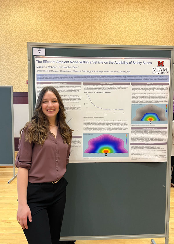 STEMM Student Participant in front of research poster