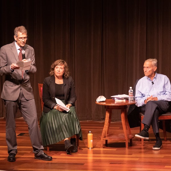 Dr. Kimberly Hamlin and John Pepper await Dr. Wietse de Boer's introduction at the beginning of the lecture.