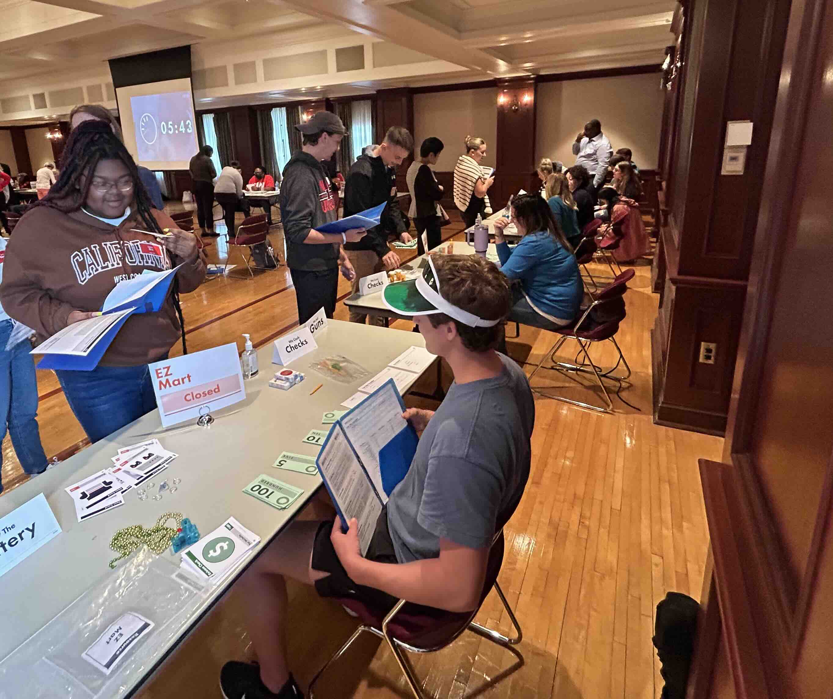 Students visiting the many different stations representing essential post-incarceration destinations during the event