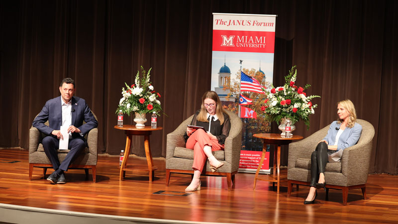 Janus Forum student president and moderator Cameron Tiefenthaler poses a question for Jason Chaffetz (left) and Laura Nirider