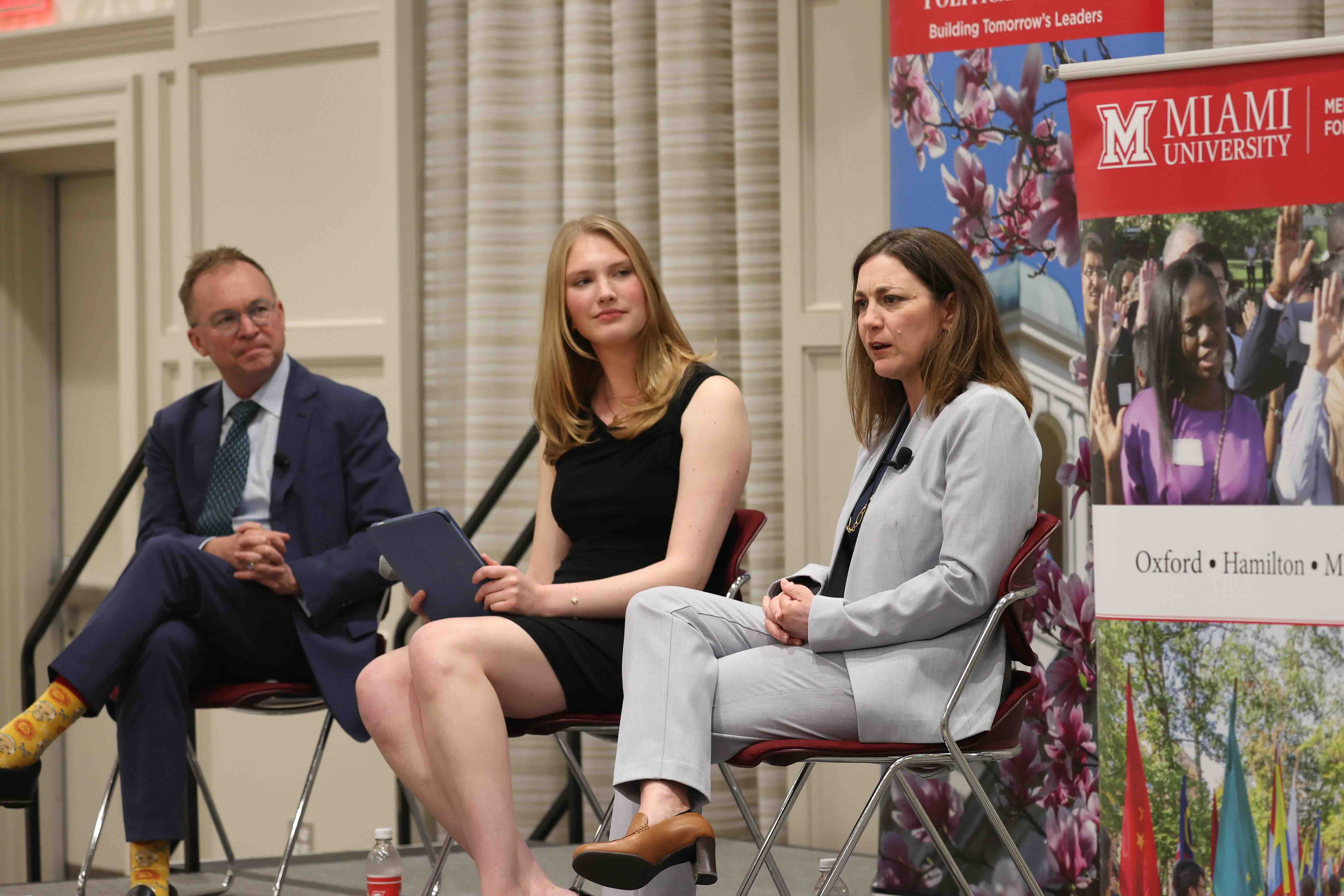 Mick Mulvaney, student moderator Grace Gaston, and Tiffany Muller at the spring 2024 Janus Forum