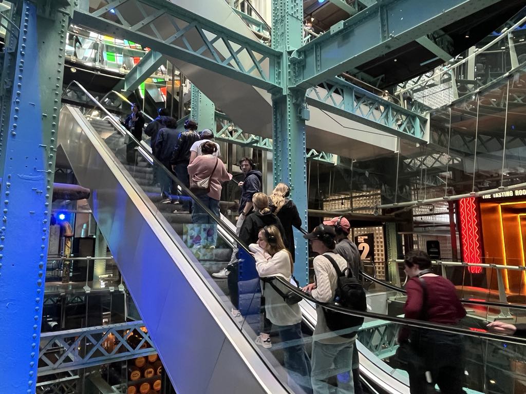 Students inside the Guinness Storehouse taking part in a guided marketing tour of the facility.