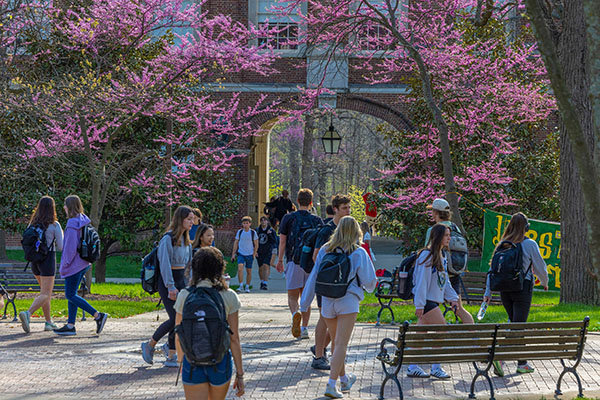 Students Walking near the seal with Upham Arch in the Background