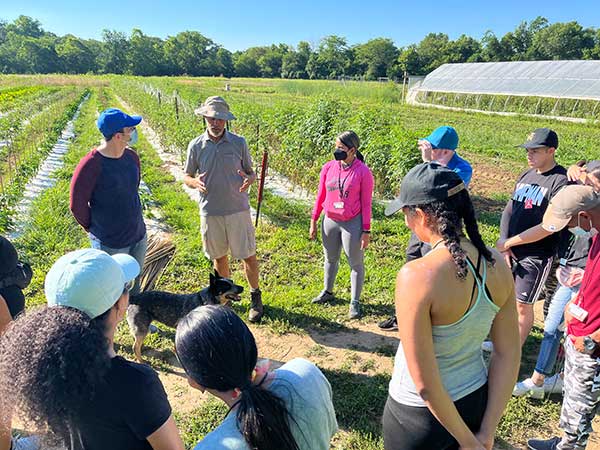 SUSI 2022 students listen to a presentation from Charles Griffin, director of farm production & operations at Miami's Institute for Food.