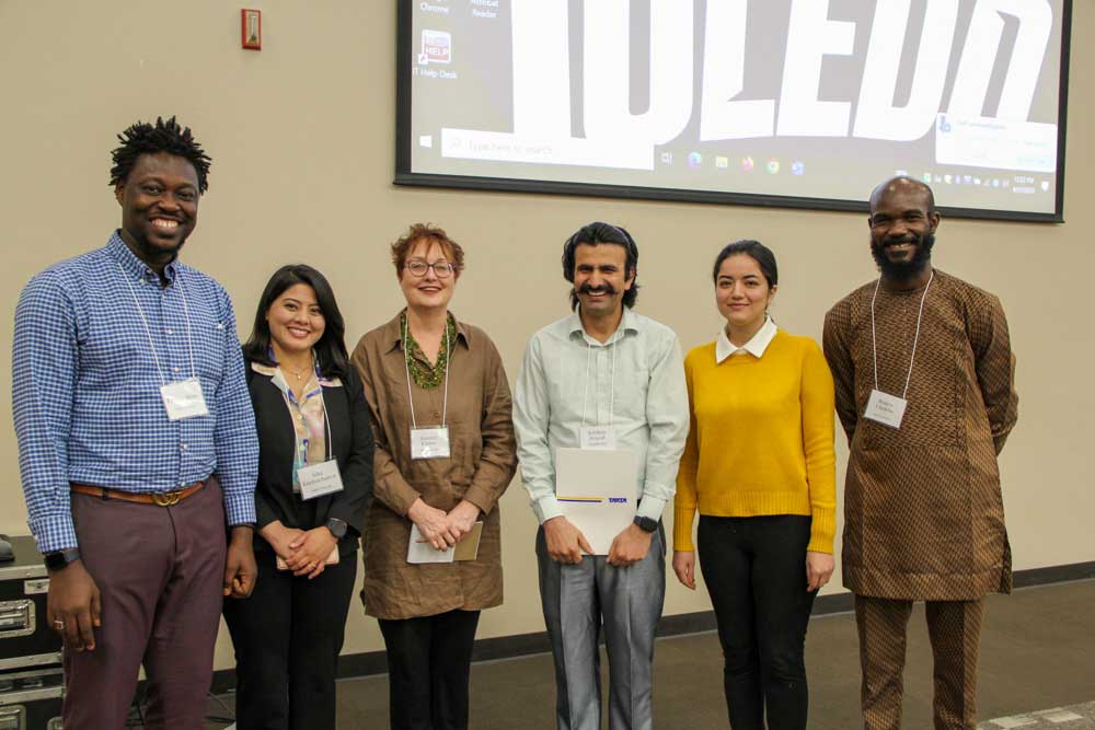 Chidebe with five other students at an aging conference.