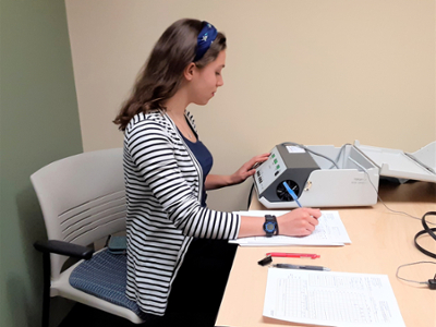 Hailey Kingsbury performs a Pure Tone Audiometry Test.