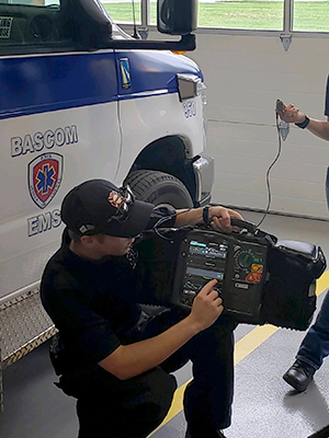Andrew Branson checking some of the EMT's monitoring equipment