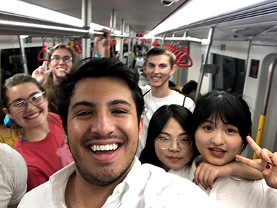 Santiago Puente Davila riding the Tianjin subway with local students