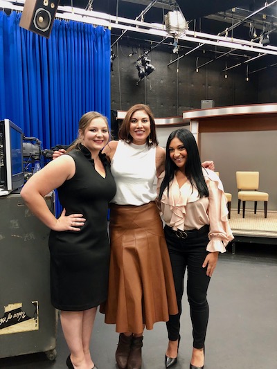Hannah Horsington and an MTN teammate pose with professional soccer player Hope Solo in Williams Hall.