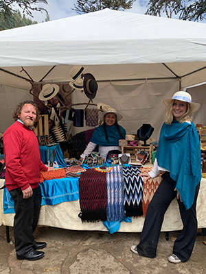 Flynn McClellan working with her boss at a fair-trade convention in Ecuador
