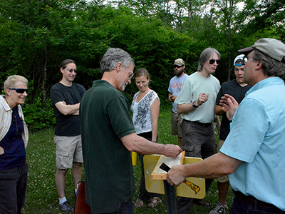 Scientists enjoy honey fresh from the hive at ERC.