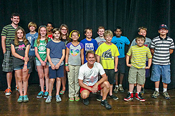 Group shot of children who participated in Spencer's Theatre of Illusion workshop