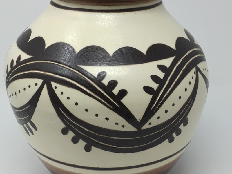 decorative ceramic pot with earth-tone colors
