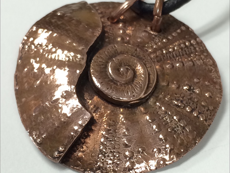 circular metal pendant